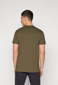Olive green short-sleeve t-shirt, round neckline, soft cotton material, slim fit, displayed from the back with no visible patterns or accents.