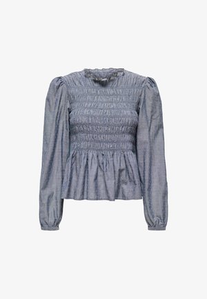 Blouse à manches bouffantes bleu clair avec corsage smocké et ourlet froncé, présentant un tissu texturé avec de petits points en relief.