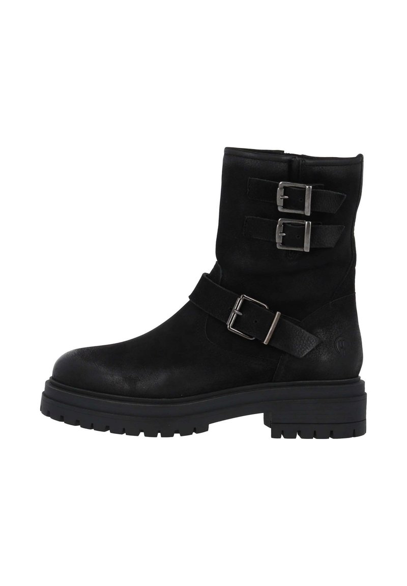Botas de cuero negro hasta el tobillo con dos hebillas decorativas, punta redonda y una suela de goma gruesa. Textura suave con un acabado mate.