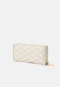 Beige zip-around wallet with repeating MK monogram pattern and gold-tone zipper pull, shown against white background.