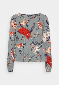 Langarmbluse aus weichem Stoff, mit floralem Muster in Rot, Pink und Blau auf grauem Hintergrund. Verstellbares Taillendetail.