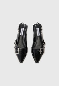 Black slingback high-heeled shoes with pointed toe, glossy leather, broad buckle strap, subtle stitching details, and silver hardware accents.