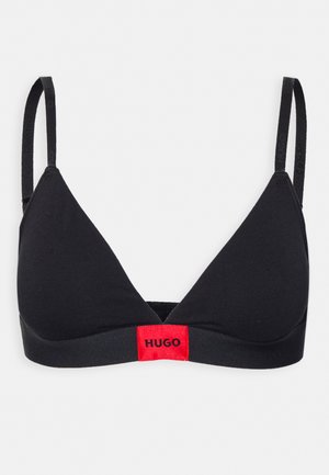 Black triangular bralette made of soft fabric. Features thin straps and a red branded band at the bottom with "HUGO" printed on it.