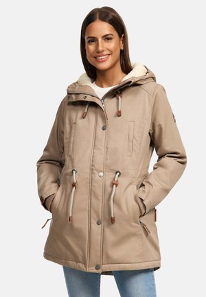 Beige parka with a fur-lined hood, drawstring waist, and brown accents. Features dual front pockets and a zip closure with snap button.
