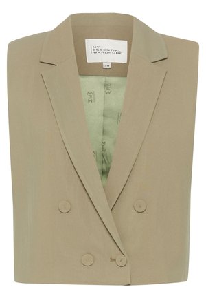 Beige, strukturerad dubbelknäppt kavaj med slagkrage. Inuti fodrad i ljusgrönt, med subtil märkning. Slät textur.