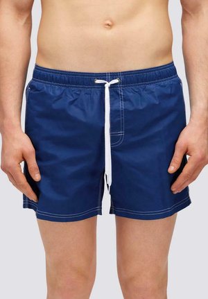 Pantaloni da bagno blu navy con vita elastica e cordino bianco, dotati di tasche laterali e dettagli in cucitura bianca a contrasto.