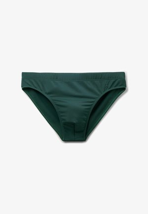 Bañador tipo slip para hombre de color verde oscuro con cinturilla elástica y logo sutil en el lado derecho, extendido sobre un fondo blanco.