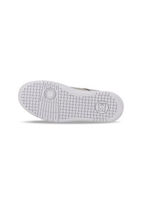 White sneaker sole with textured grip pattern, circular accents, and a logo embedded near the heel. Flat design suitable for casual wear.