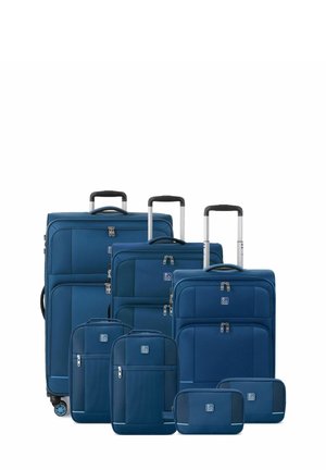 Set of blue luggage including a large suitcase, two medium suitcases, and three smaller bags. Features zippers, handles, and textured fabric.