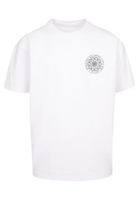White cotton t-shirt with short sleeves. Features a circular, gray graphic design printed on the left chest area. Simple and classic shape.