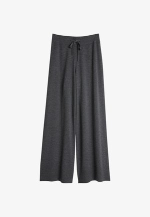 Grå vide bukser laget av mykt stoff med strammesnor i livet. Har en avslappet passform og rillede mansjettdetaljer i kanten.