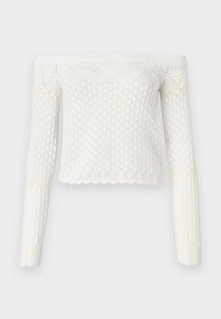 Fehér, off-shoulder kötött crop top gyémántmintával, hosszú ujjal és fodros aljjal. Texturált kötött anyagból készült.