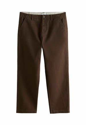 Prune puuvillased püksid, millel on lame esiosa, küljetaskud ja sile tekstuur. Vöös on nupuga kinnis.