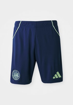 Navy athletic shorts with green accents, elastic waistband, side pockets, logo patch, and three-stripe design on the lower leg.