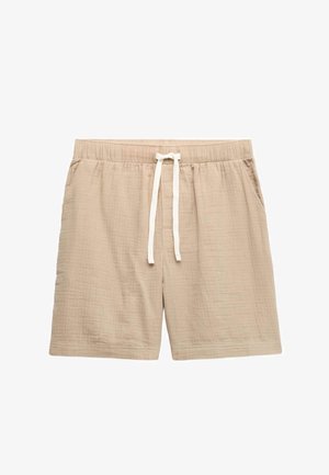 Shorts beiges décontractés avec taille élastique et cordon blanc, fabriqués en tissu léger texturé, dotés de poches latérales.