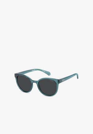 Transparent teal round sunglasses with dark lenses and slim arms, branded Polaroid on the temples and inside the frame.