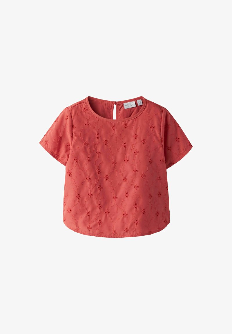 Koral kortermet topp med rund hals, med blomsterbroderi, detalj med nøkkelhull bak og teksturert finish. Uformelt design.