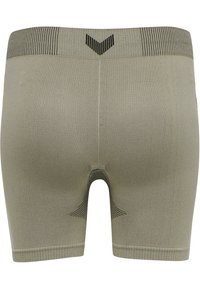 Kompressionsshorts i ljus khaki, med en ribbad mörk midjeresår och förstärkta sömmar, sömlös design och en tät passform.