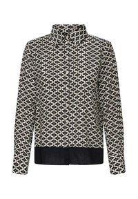 Chemise à manches longues avec un col boutonné, présentant un motif géométrique noir et crème et un ourlet noir uni. Texture de tissu lisse.