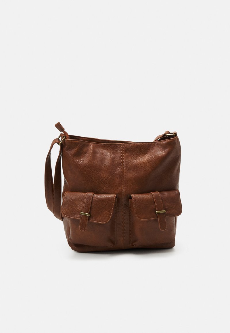Brown leather shoulder bag with a smooth texture, featuring two front pockets with flap closures and a adjustable strap.