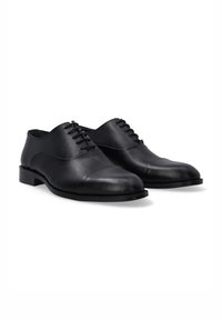 Zwarte leren schoenen met een ronde neus, een gladde afwerking en een vetersluiting. Middelhoge hak en een minimalistische stijl.