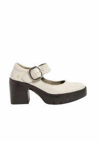 Cream-colored leather Mary Jane shoes with a round toe, adjustable buckle strap, and chunky brown heel with a ridged sole.