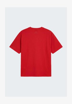 Plain red short-sleeve T-shirt with a small, subtle logo printed at the upper back near the neckline.