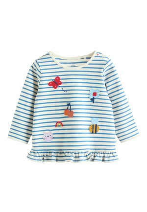 Gestreiftes Langarmshirt in Creme und Blau, mit bestickten Schmetterlingen, Blumen, einem Regenbogen und anderen Symbolen. Rüschen-Saumdetail.