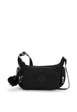 Bolso bandolera negro de nailon con superficie texturizada, dos compartimentos con cremallera, un parche redondo con el logo y un llavero con pompón de felpa.