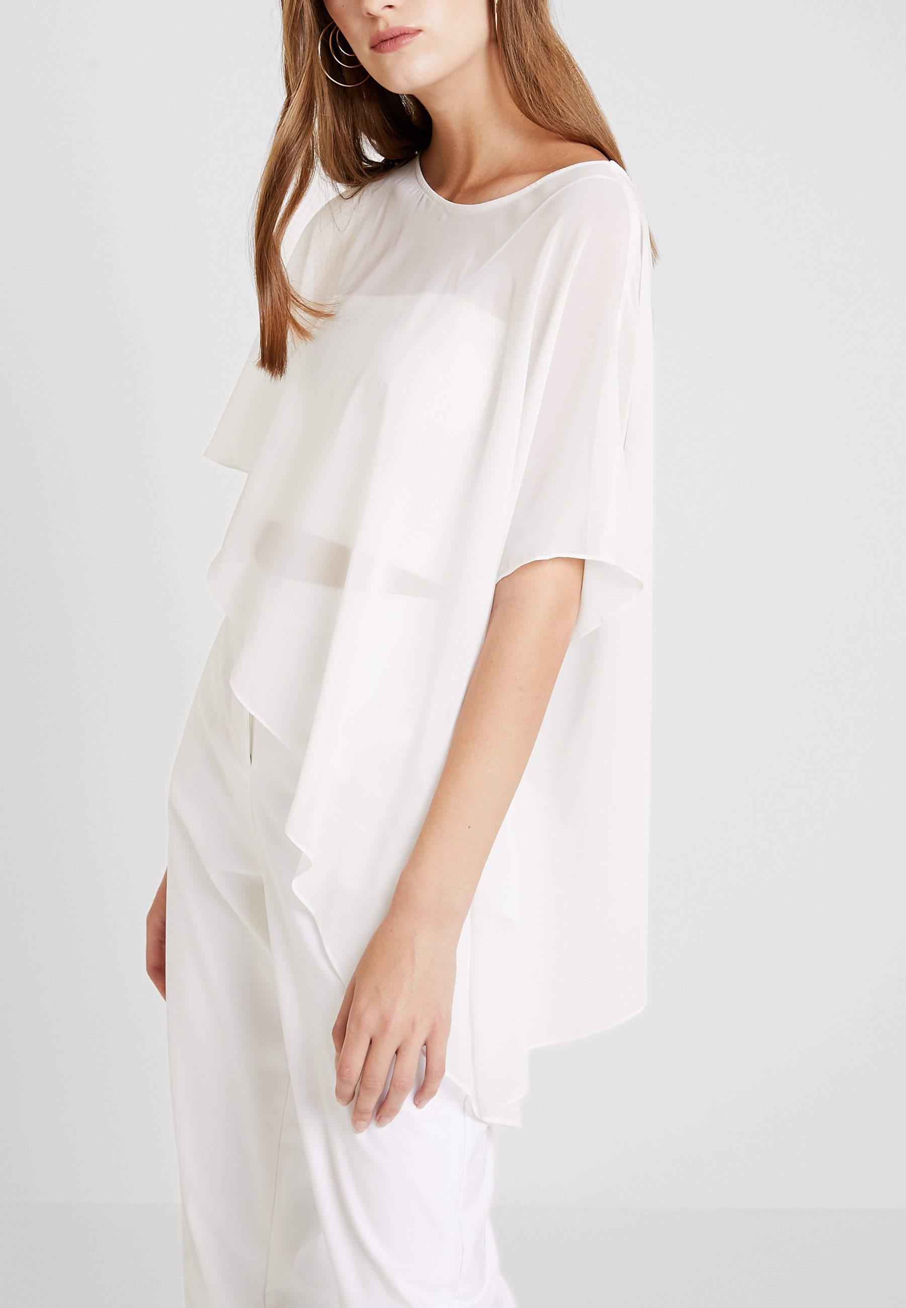 Swing Cape creme weiss Zalando.no Swing Cape - champagner