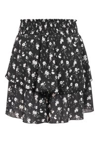 Gonna nera a strati con motivo floreale di margherite bianche e fascia elastica arricciata in vita, tessuto leggero con orlo fluente.