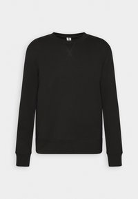Sudadera de algodón negra con mangas largas, cuello redondo y puños y dobladillo acanalados. Presenta un sutil detalle de puntada cruzada en el cuello.