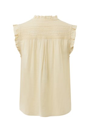 Mouwloze crèmekleurige blouse met gerafelde randen, ingewikkelde kanten inzet en geplooide achterkant.