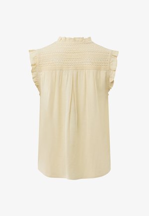Mouwloze crèmekleurige blouse met gerafelde randen, ingewikkelde kanten inzet en geplooide achterkant.