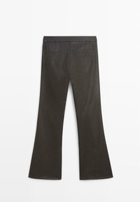 Dark brown flared pants with two back welt pockets, displayed flat on a white background, showing rear view and waistband details.