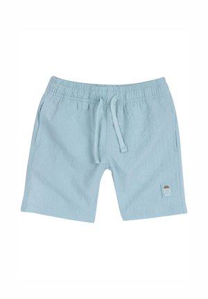 Shorts bleu clair en tissu texturé. Dotés d'une taille élastique avec cordon de serrage et d'un petit patch logo sur le côté.