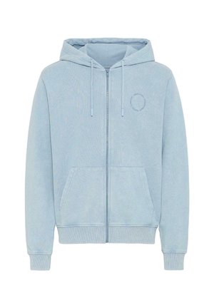 Helehall sinine tõmblukuga kapuutsiga jakk, valmistatud pehmest kangast, millel on nööriga kapuuts, kaks esist taskut ning soonilised mansetid ja äär. Peen ümmarguse logoga detail.