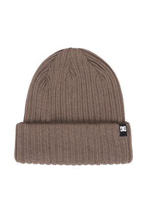 Brown ribbed knit beanie with folded cuff and small black fabric logo tag on the cuff's right side.