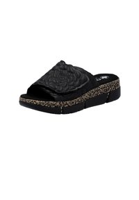 Black slide sandal featuring a floral embossed design on the upper, textured sole, and a patterned cork accent along the platform.