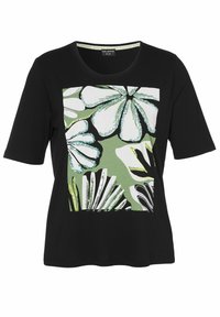 Schwarzes T-Shirt mit kurzen Ärmeln, das ein auffälliges Blumendesign in Grün, Weiß und Schwarz mit dekorativen Akzenten zeigt. Runder Halsausschnitt, lässiger Schnitt.