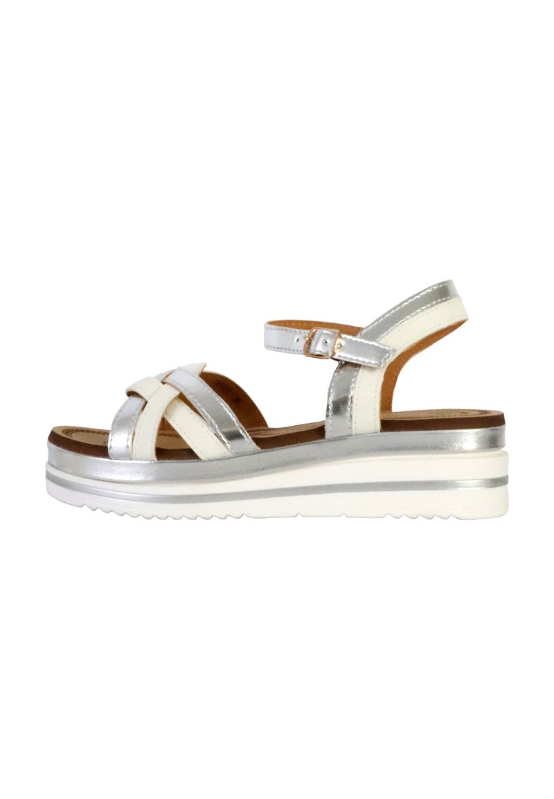 Silver and white women's sandal with adjustable ankle strap, crisscross upper, and a thick white platform sole with silver accents.