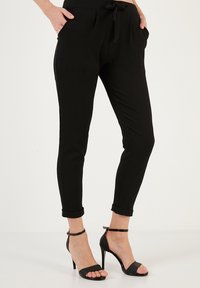 LELA SLIM FIT - Trousers - black