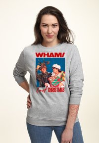 Felpa grigia chiara con un design grafico colorato che presenta il testo "WHAM!" e "Last Christmas", raffigurante due persone in abbigliamento festivo.