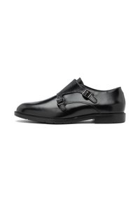 Zwarte leren schoenen met een glanzende afwerking, voorzien van twee verstelbare gespen op de bovenkant, een ronde neus en een lage rubberen zool.