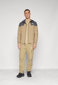 The North Face WIND TRACK HOODIE - Giacca a vento - kelp tan/anthracite grey