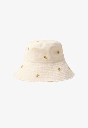 Lys beige bøllehat pyntet med små broderede ananas fordelt jævnt rundt om hatten.