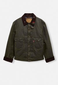 Σκοτεινό πράσινο αδιάβροχο βαμβακερό σακάκι με καφέ κοτλέ γιακά, δύο μπροστινές τσέπες και κούμπωμα με κουμπιά. Διαθέτ�ει χαλαρή εφαρμογή και ορατή ραφή.