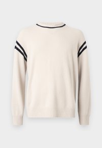 Ανοιχτό μπεζ πουλόβερ από μαλακό υλικό, με στρογγυλή λαιμόκοψη, μανσέτες με ρίγες και μαύρες ρίγες κατά μήκος των ώμων για διακόσμηση.