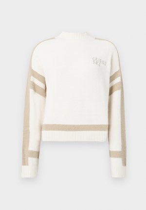 Beskarpet, cremelilla sweater lavet af blødt materiale, med beige striber og broderet "GUESS SKI" logo på venstre bryst.