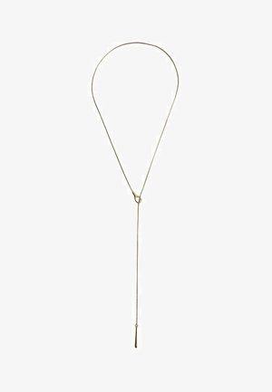 Delicate gold necklace with a looped design and a thin chain hanging down, ending in a small elongated pendant.
